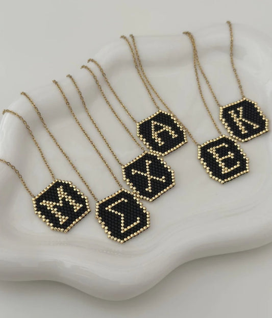 ατσάλινο κολιέ μονόγραμμα